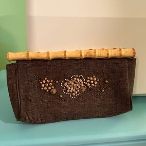 Brown beaded front clutch purse. Sold by Avon.